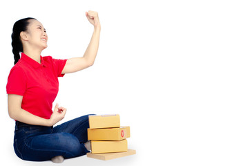 Asian women in a red shirt, blue pants, she smiled and held several brown boxes at the same time isolated white background.Women send parcels.