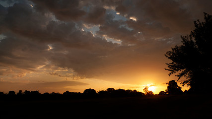 Golden sunrise or sunset with dramatic clouds