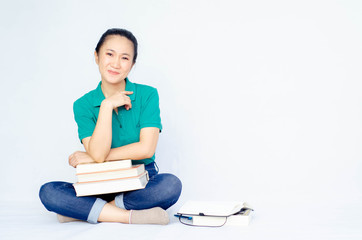 Asian women in a green shirt. she smiled and held several brown boxes at the same time isolated white background.Women send parcels.