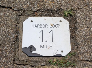 A close view of the distance marker on the pathway.