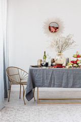 Stylish chair next to elegant dining table set for party
