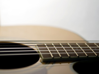 Fototapeta premium six - string acoustic guitar on a white background. music day