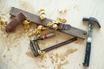 Top view tools of carpenter with sawdust