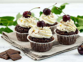 Chocolate Cupcakes with Cherry and White Cream