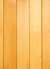 Background from natural light new wooden boards. Cedar wood. Vertical position.