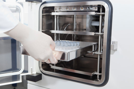 Germany, Bavaria, Munich, Scientist researching lyophilisation of proteins in laboratory