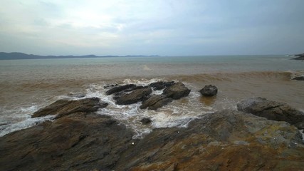 4k video of sea wave with stone at Khao Laem Ya in Mu Ko Samet National Park, Rayong Province, Thailand