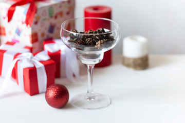New Year and Christmas concept. Toys, gifts, tree, glass with cones, garland