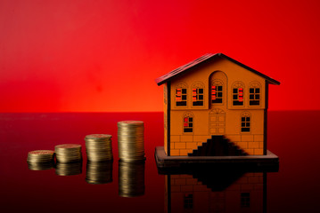 Planning to build your dream home with coins stack chart and home miniature