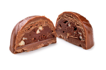 Broken chocolate candy, white background, top view