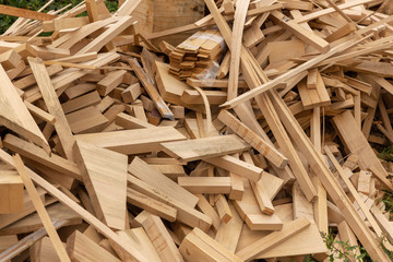 Remains of oak lumber piled in a pile for further processing.