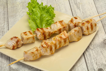 Grilled pork skewer served salad