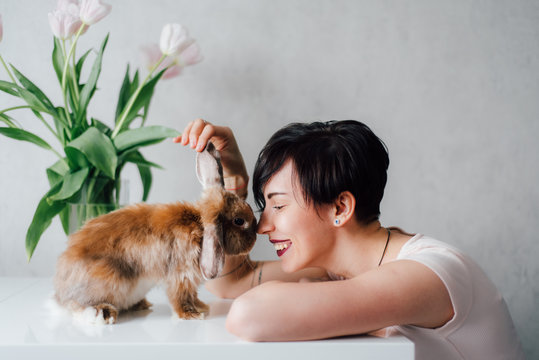 Smiling woman with cute hare