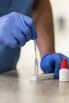 Clinic: Medical Tech Runs Strep Test On Patient Sample