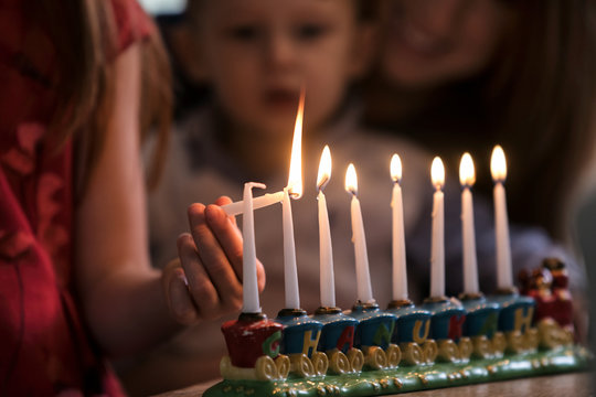 Hanukkah: Siblings Lighting Holiday Candles