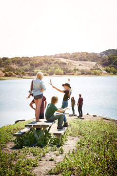 Woman dancing with friends in nature