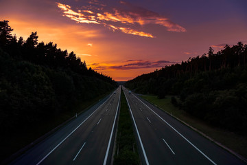 Empty highway at sunset 