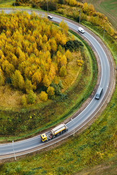Highway through autumn forest