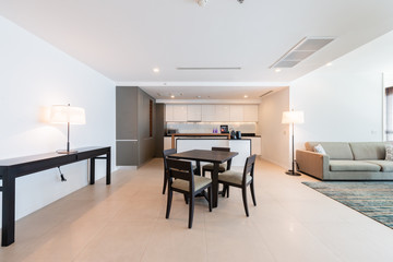 Stylish kitchen interior with dining table and chairs