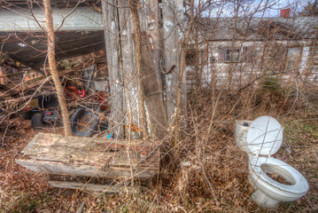 junky abandoned property with weeds and toilet, rural Kansas