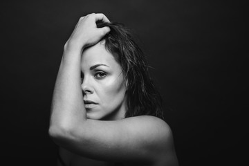 Black and white portrait of a young pensive woman