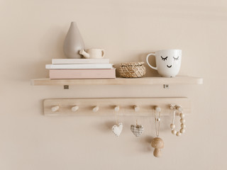 Cup and decorations on shelf