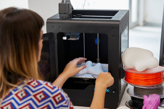 Closeup Of Student Making 3D Model In Printer