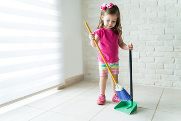 Toddler Sweeping Floor At Home
