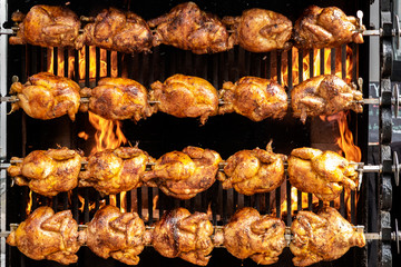 Street food: Chicken being grilled on large grill