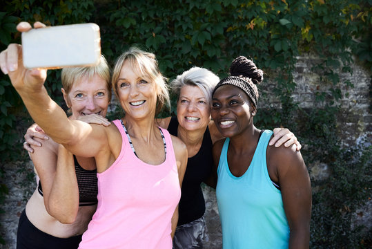 Senior Ladies Taking Selfie Outdoors After Workout.