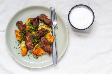 Roasted meat and fried potato with sauce ketchup and mayonnaise
