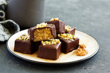 Homemade candy roasted with nuts and caramel. Selective focus
