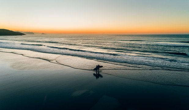 Aerial view of a wild beach at sunset