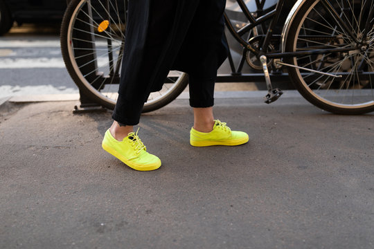 female legs with yellow shoes