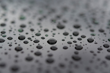 Abstract background with water drops on metal surface