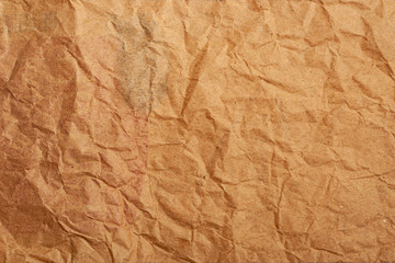 Brown crumpled thick paper for the background. Recycled creased cardboard. Environmentally friendly product.