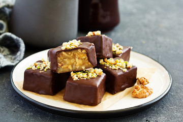 Homemade candy roasted with nuts and caramel. Selective focus