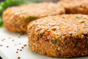 Tasty vegetarian burgers made from healthy quinoa, basil, tomatoes and mozzarella cheese