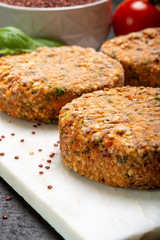Tasty vegetarian burgers made from healthy quinoa, basil, tomatoes and mozzarella cheese