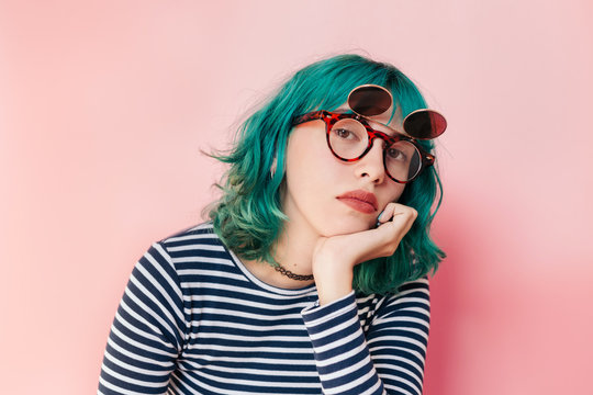 Nerdy teenager with turquoise hair