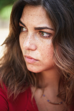 close up portrait of worried woman looking away