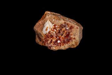 Macro mineral stone Vanadinite on a black background