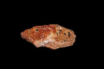 Macro mineral stone Vanadinite on a black background