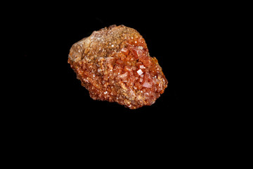 Macro mineral stone Vanadinite on a black background