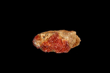 Macro mineral stone Vanadinite on a black background