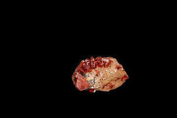 Macro mineral stone Vanadinite on a black background