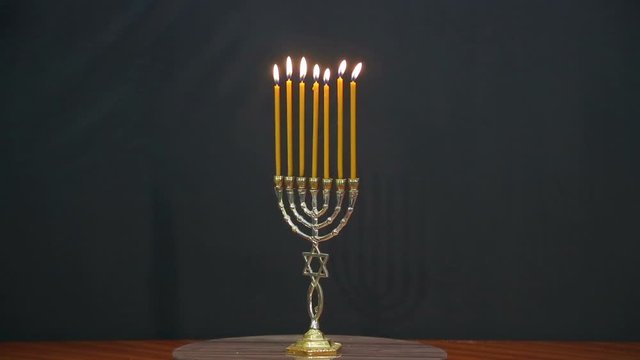 Menorah with burning candles on the eve of the holiday