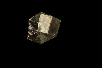 Macro mineral stone Pyrite on a black background