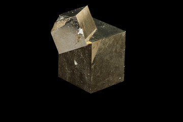 Macro mineral stone Pyrite on a black background