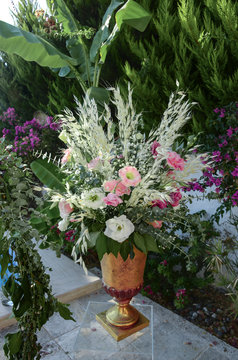 Luxury floral arrangement of pink and white flowers in glass vases. Flowers for wedding decoration